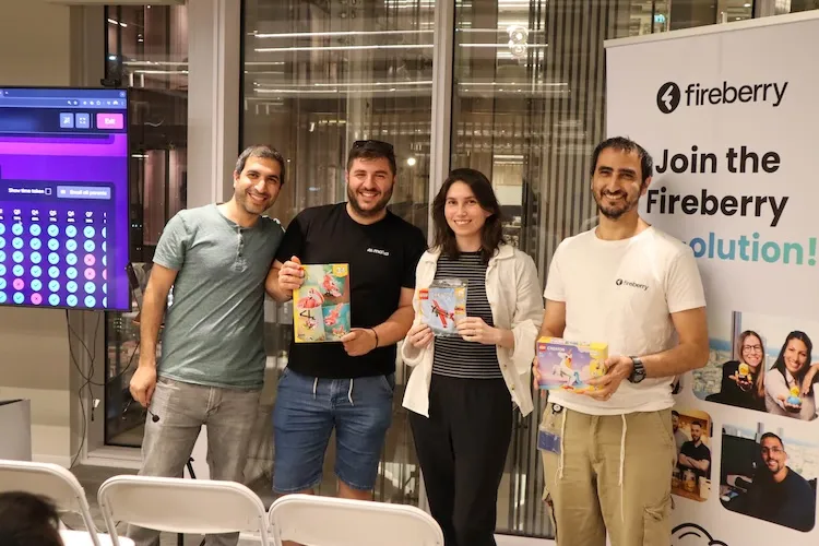 Community meetup photo at Fireberry, attendees getting rewards for participating and winning